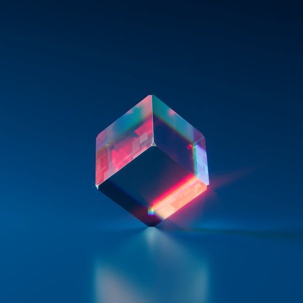 image of transparent cube with light refraction on dark-blue background